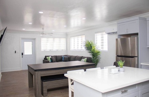 Coral Harbour Apartment | Tangerine Sunsets Pink Marlin