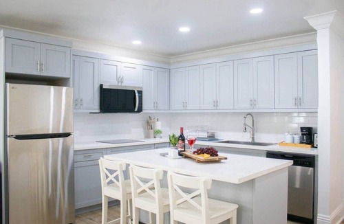 Coral Harbour Apartment | Tangerine Sunsets Pink Marlin