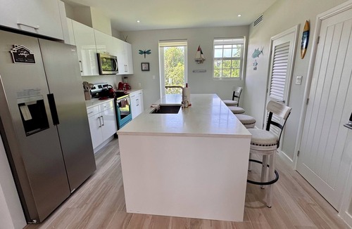 Palm Cay Apartment | Unwind with the whole family at this 3-bedrooms. Nestled just steps from a pool.