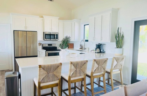 Treasure Cay House | Waterfront 5BR Oasis - 50’ Private Dock - 6-Seater Golf Cart Option