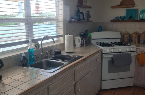 Lubbers Quarters Cay Villa | WATERFRONT VILLA with deck to enjoy the scenic views & historical lighthouse.