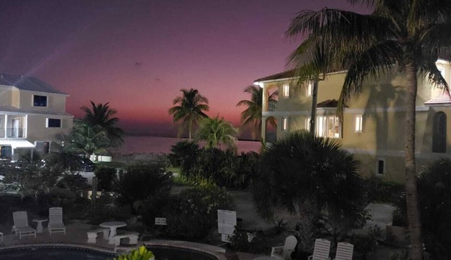 2-bedroom condo in oceanfront complex in Freeport with pool, WiFi, beach chairs.