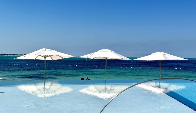 30 day rental, corner unit, water & golf course views, resort beach and pool