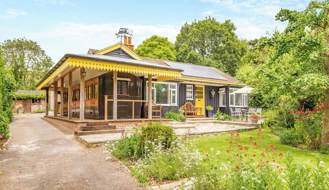 A charming bungalow with an LSWR train attached.