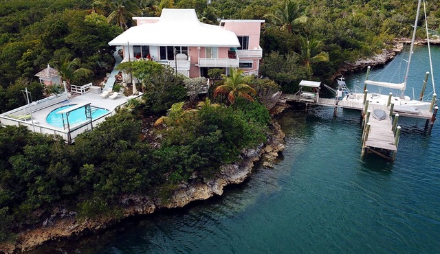 Charming and Secluded Home on the Bay with Fresh Water Pool, Dock, Views.