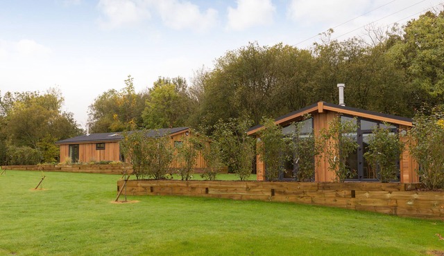 Escape from it all and enjoy a stylish lodge in a beautiful setting.