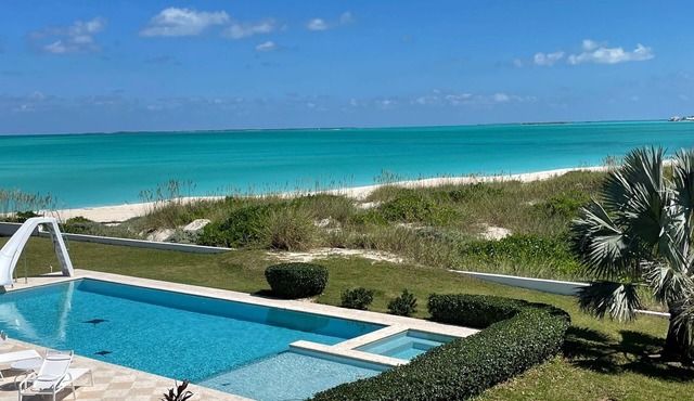 Family estate coach house and guest house on TC beach with beautiful pool