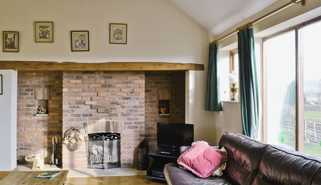 Ground Floor: Living room: TV, Open Fire Dining room.