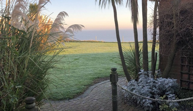 Log Cabin next to our sandy beach with lovely sea views, close Norfolk Broads.
