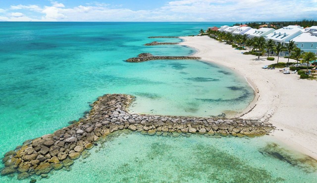 Luxury Beach side escape, steps from private beach, restaurant, marina, and café