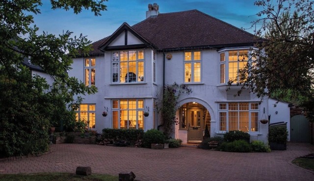 Luxury family home in Surrey, UK with garden, pool table, fireplace & playground