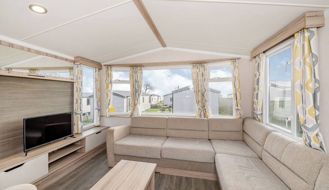 Modern and spacious 12ft-wide caravan with one double and two twin.