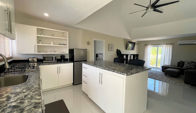 Newly Built 2-Bedroom Villa Short Walk From Beach & Minutes away from Airport!