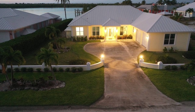 Newly Remodeled Home with Pool on the Harbor with a Beach view an a 22x40 dock.