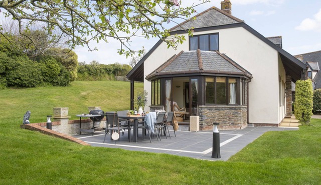Overlooking the lakes of Roserrow, April Cottage is in an enviable location.