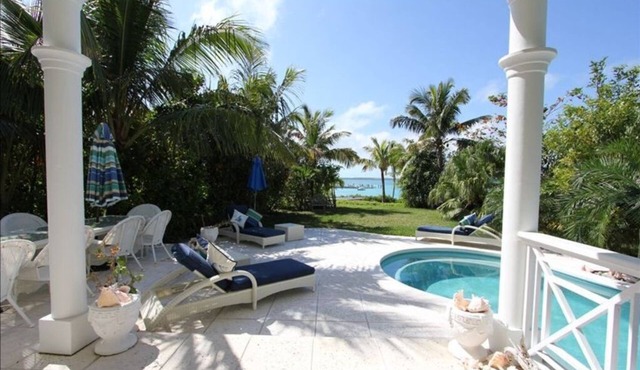 Stunning waterfront property with panoramic sunset views + pool + dock
