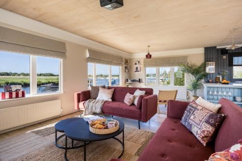 Stunning Waterfront, Wood Fired Hot Tub, Projector & Log Burner