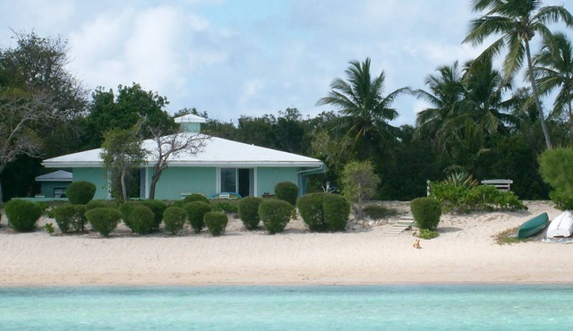 The Barefoot Beach House sits on a sandy beach