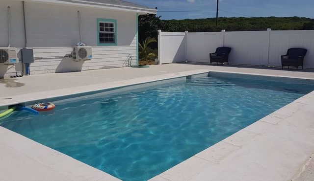 The Palm House with Swimming Pool and Beach Access.