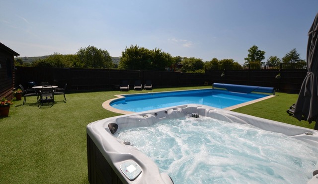 The Pool House studio chalet with pool and hot tub