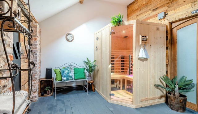 This picture-perfect barn conversion, boasts a private hot tub and sauna.