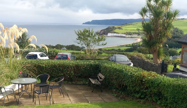 Traditional 5 bedroom house overlooking Cushendun bay. Pet friendly.