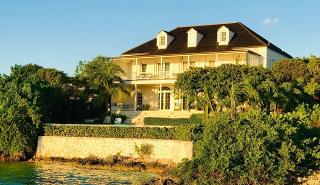 Wind Whistle Harbour Villa- a classic Bahamian 2.5 story veranda-style house.