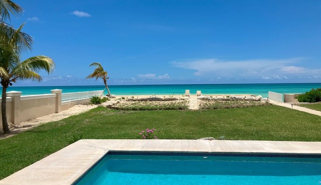 Beach front pool home with striking views and space for family and friends.